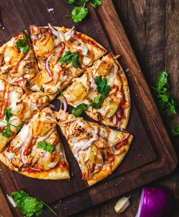 Close-up of a freshly baked Classic Margherita pizza with vibrant basil leaves and bubbling mozzarella straight from the RustBlock oven