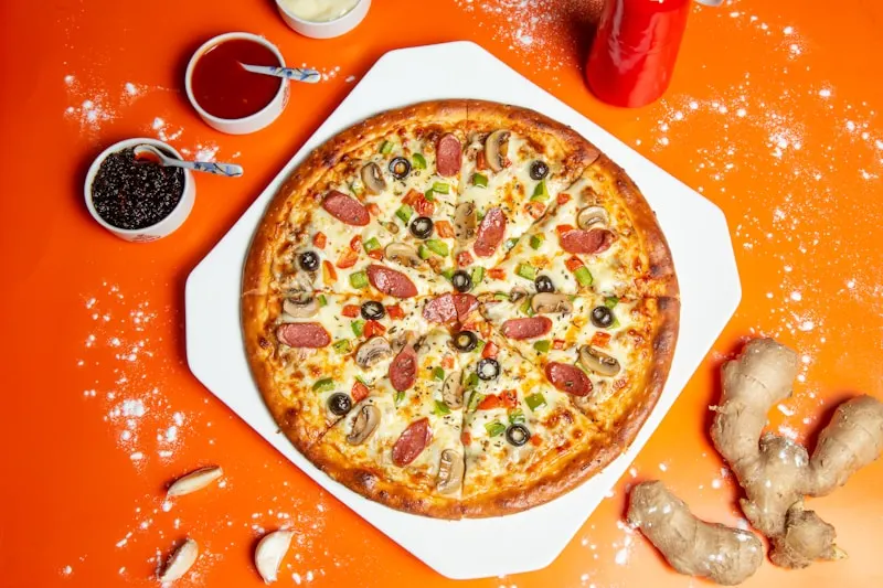 RustBlock pizza with colorful fresh vegetables